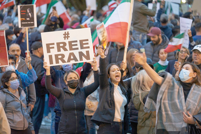 People demonstrate against the Iranian government during a protest at Mel Lastman Square in Toronto, Ontario, Saturday (AFP photo)