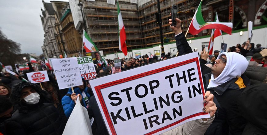 Protesters hold placards at a march in central London on Monday against the Iranian regime, on the third anniversary of the downing of Ukrainian passenger jet, flight PS752, shortly after its takeoff from Tehran (AFP photo)