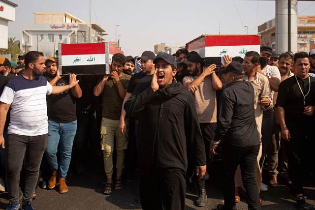 Iraqi mourners attend the funeral of two Saraya Al Salam fighters, an armed faction linked to powerful Shiite cleric Moqtada Sadr, in the southern Iraqi city of Basra on Thursday (AFP photo)