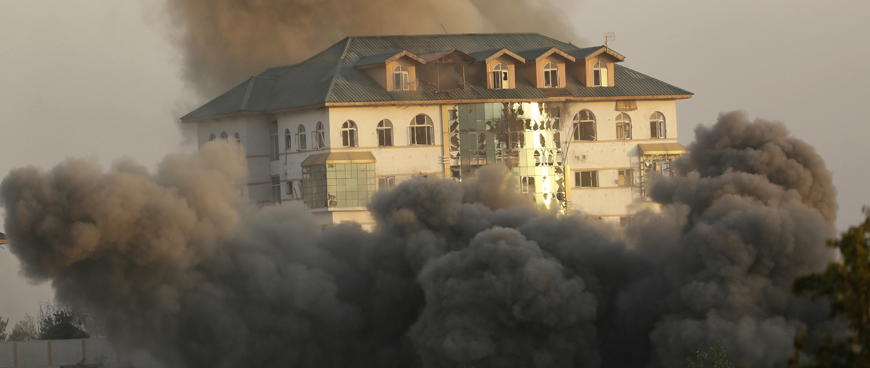 Smoke and dust rise from a government building where suspected militants have taken refuge during a gun battle in Pampore, on the outskirts of Srinagar, Indian controlled Kashmir, Monday (AP photo)