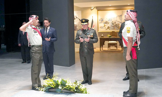   His Majesty King Abdullah, the Supreme Commander of the Jordan Armed Forces-Arab Army, lays a wreath and recites verses from the holy Koran at the Tomb of the Unknown Soldier in Amman on Monday (Photo courtesy of Royal Court)