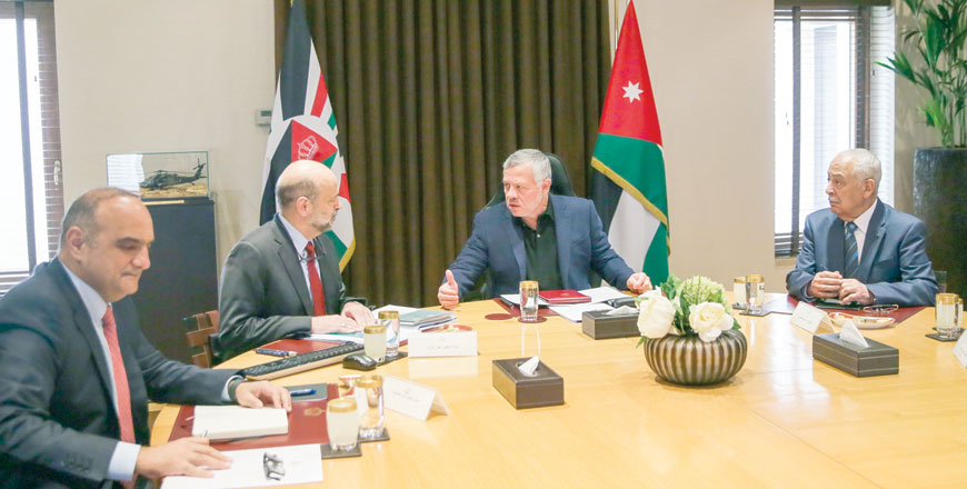 His Majesty King Abdullah receives a report on Sunday submitted by Prime Minister Omar Razzaz on the government’s key achievements over the year 2019 (Photo courtesy of Royal Court)
