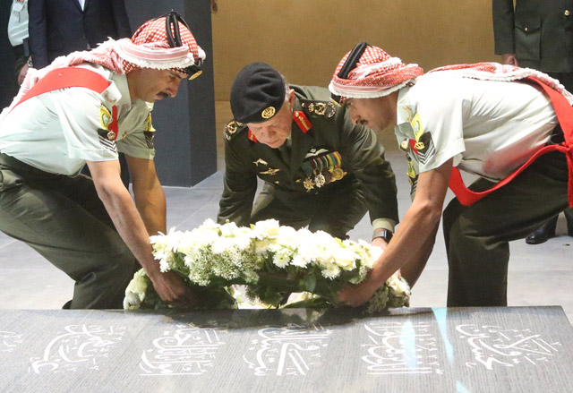 His Majesty King Abdullah lays a wreath at the Unknown Soldier monument during an army celebration of national days in Amman on Thursday  (Photo courtesy of Royal Court)