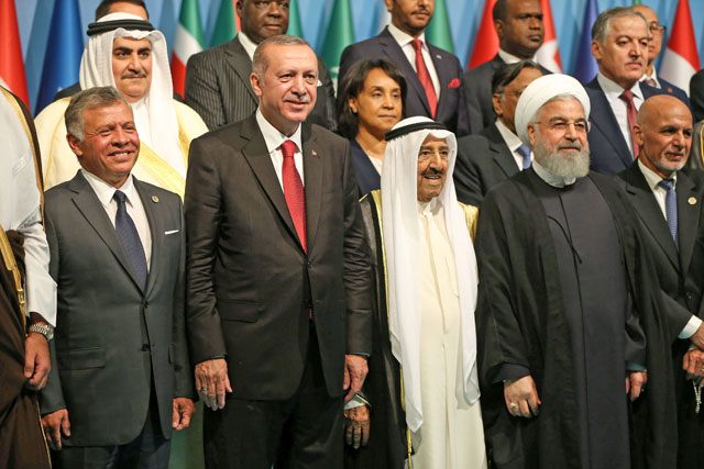 His Majesty King Abdullah joins Muslim leaders, including host  Turkish President Recep Tayyip Erdogan, for a group photo during the extraordinary meeting of the Organisation of Islamic Cooperation in Istanbul on Friday (Reuters photo)