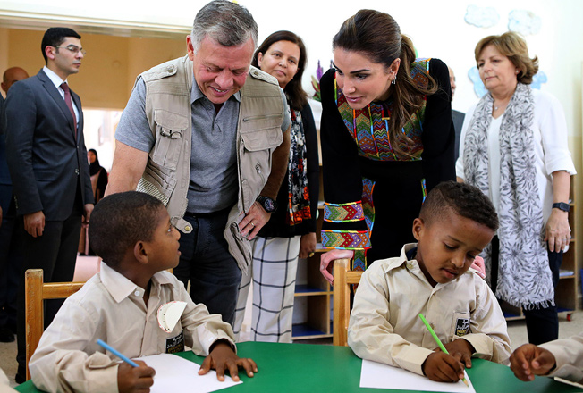 Their Majesties King Abdullah and Queen Rania visit a Jordan Valley community on Wednesday  (Photo courtesy of Royal Court)