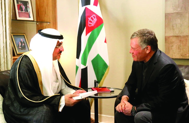 His Majesty King Abdullah receives a written letter from Saudi King Salman Bin Abdulaziz, delivered by Saudi Cabinet member Essam Bin Saad Bin Saeed, in Amman on Tuesday (photo courtesy of Royal Court)