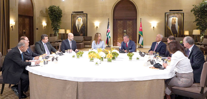 Their Majesties King Abdullah and Queen Rania attend a meeting to check on progress in a human resources strategy in Amman on Sunday (Photo courtesy of Royal Court)