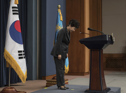 In this Friday file photo, South Korean President Park Geun-hye bows before addressing the nation over a ‘heartbreaking’ scandal at the presidential Blue House in Seoul (AP photo)