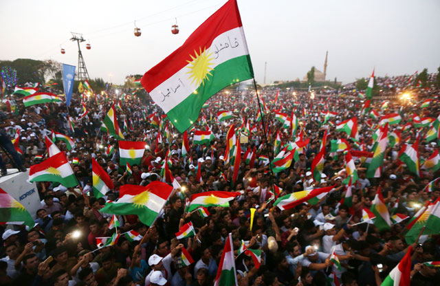Iraqi Kurds fly Kurdish flags during an event to urge people to vote in the upcoming independence referendum in Erbil, the capital of the autonomous Kurdish region of northern Iraq, on Saturday (AFP photo)