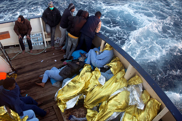 Sub-Saharan migrants rest aboard the former fishing trawler Golfo Azzurro of the Spanish NGO Proactiva Open Arms, following a rescue operation near the coasts of Libya in the central Mediterranean Sea, on Friday (Reuters photo)