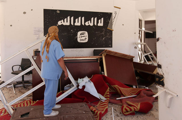 A Libyan man checks a building used by Daesh militants after it was captured by Libyan forces allied with the UN-backed government in Sirte, Libya, on August 22, 2016 (Reuters photo)
