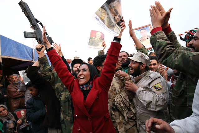 Libyans demonstrate in support of eastern Libya’s troops commanded by military strongman Khalifa Haftar (portrait) on Friday in Benghazi (AFP photo)