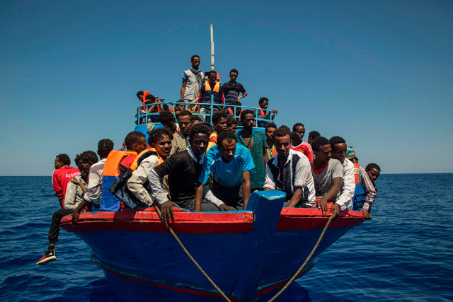 Migrants wait to be rescued by the Aquarius rescue ship run by non-governmental organisations ‘SOS Mediterranee’ and ‘Medecins Sans Frontieres’ (Doctors Without Borders) in the Mediterranean Sea, 30 nautical miles from the Libyan coast, on Wednesday (AFP photo)