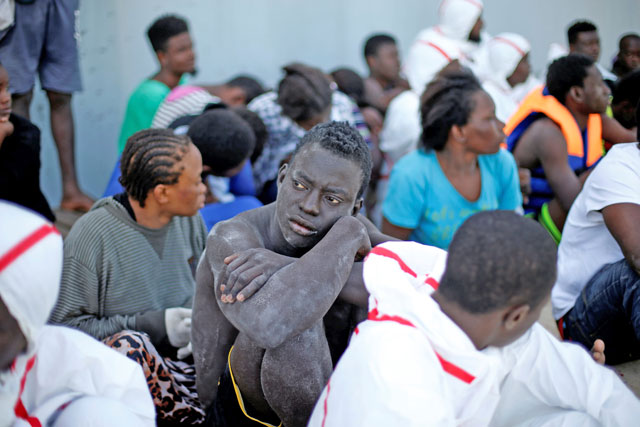 Migrants arrive at a naval base after they were rescued by Libyan coastal guards in Tripoli, Libya, on Monday (Reuters photo)