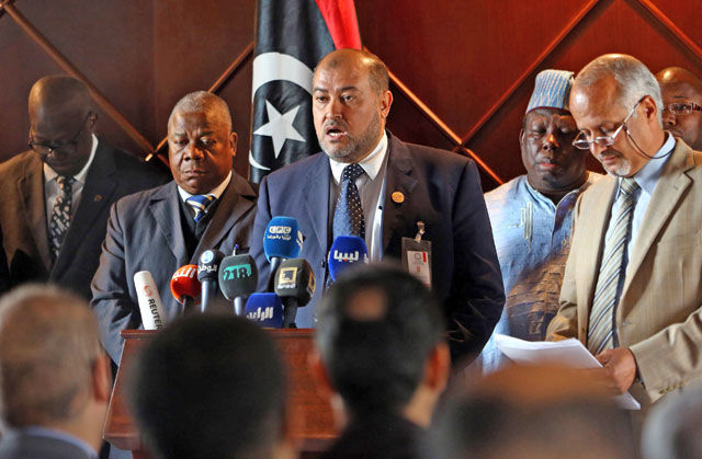 Salah Abu Raguigah (centre), head of the department of African affaires in the Libyan foreign ministry in the National Accord Government, delivers a statement to the press in the presense of African ambassadors to Libya, on Sunday, in Tripoli (AFP photo)