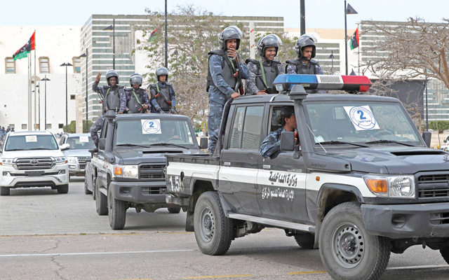 Libyan security forces keep watch outside Ouagadougou Conference Centre in the north-central city of Sirte on Wednesday during a parliament session (AFP photo)