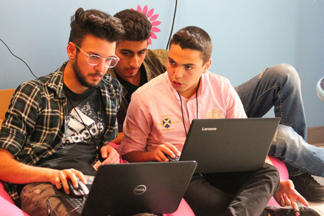 Three young men take part in the Hacking Literacy challenge at Zain Innovation Campus this weekend (Photo courtesy of ILearn)