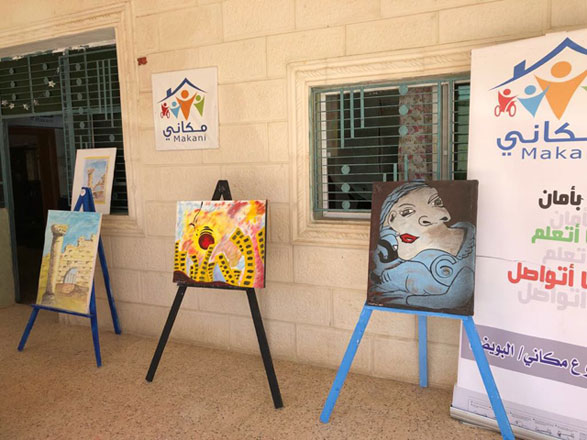 The paintings Ala did with her feet are displayed outside the Mafraq Makani Centre  (Photo by Camille Dupire)