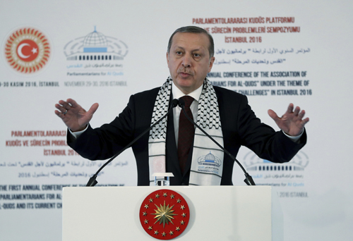 Turkey’s President Recep Tayyip Erdogan addresses a parliamentary symposium on Jerusalem, in Istanbul, on Tuesday (AP photo)