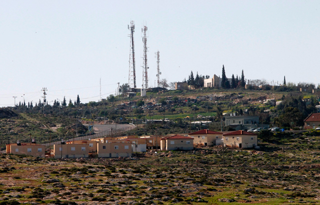 A photo taken from a Palestinian village south of Yatta in the southern area of the West Bank town of Hebron shows the Israeli settlement unit of Beit Yatir on Wednesday (AFP photo)