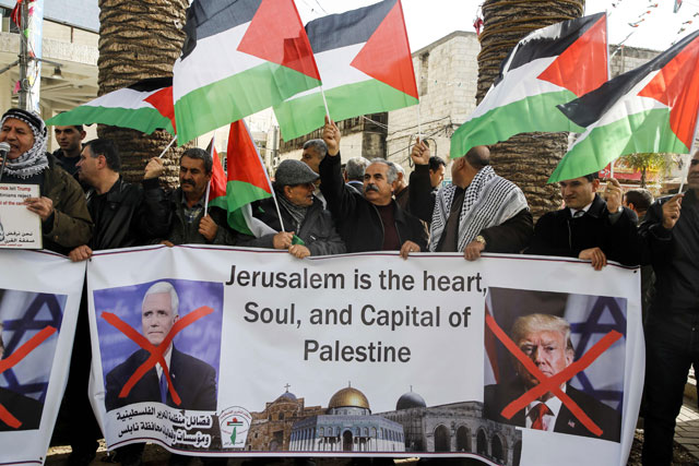 Palestinians shout slogans as they demonstrate against US vice president's visit to Israel, in Nablus in the Israeli occupied West Bank, on Monday (AFP photo)