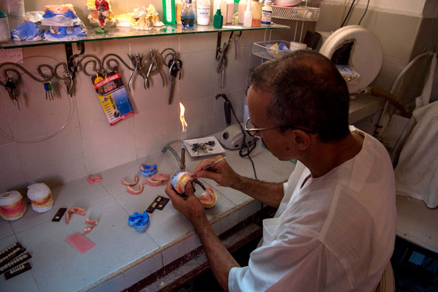 A dental technician works on dentures for a patient in the Moroccan capital of Rabat on September 11 (AFP photo)