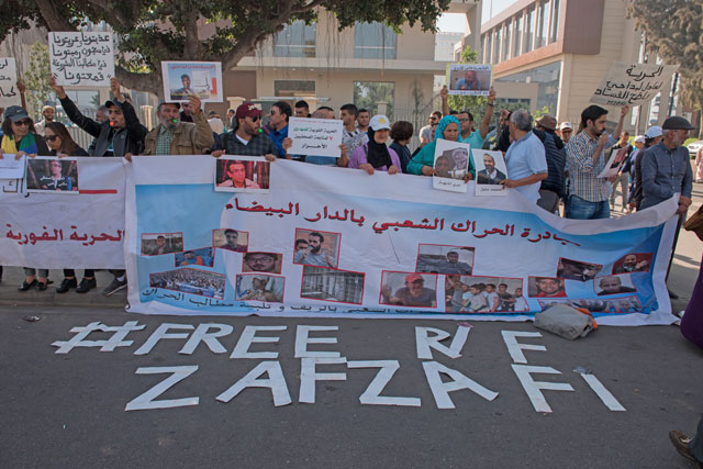 Protesters hold placards during a demonstration outside Casablanca Court of Appeals to support the Rif movement leaders who got arrested due to organising protests, ahead of their first trial in Casablanca, Morocco, on Tuesday (Anadolu Agency photo)