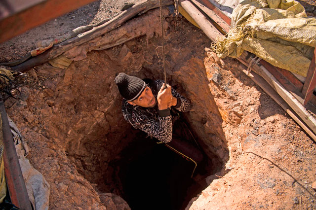 A Moroccan man gestures as he shows an abandoned coal mine in the northeastern city of Jerada, 60 kilometres southwest of Oujda in the Oriental region, on Tuesday (AFP photo)