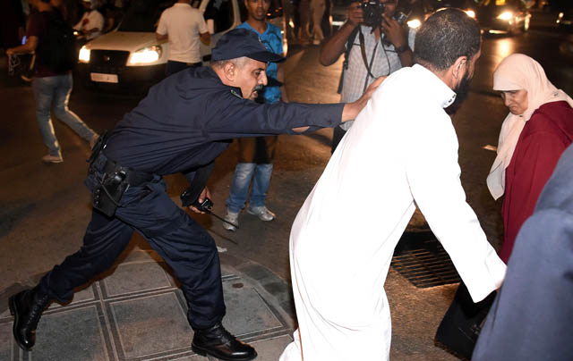 Security forces seize a demonstrator in Rabat on Tuesday during a protest in support of the grassroots movement for the neglected Rif region (AFP photo)