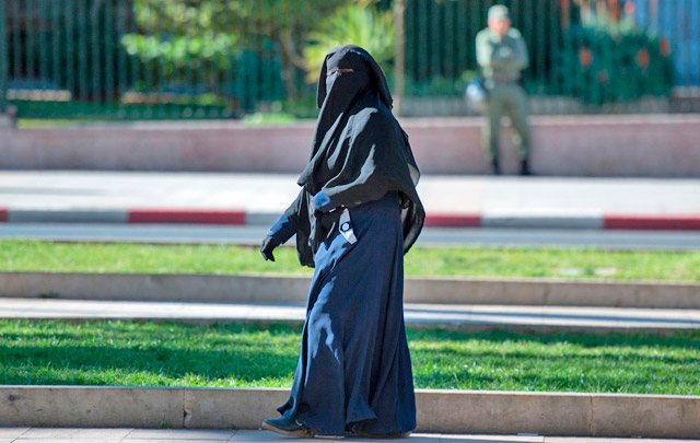 This file photo taken on January 15 shows a woman wearing a niqab walking along a street in the Moroccan capital Rabat (AFP photo)