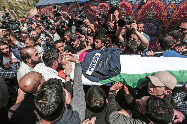 The funeral ceremony of Yassser Murtaja, 30, a Palestinian news reporter who was shot by Israeli occupation forces while covering a rally within the ‘Great March of Return’ on the Gaza border, is held in Gaza on Saturday (Anadolu Agrncy photo)