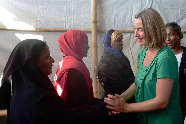 EU's foreign policy chief Federica Mogherini (right) shakes hand with Rohingya refugees at the Kutupalong refugee camp in the Bangladeshi district of Ukhia on Sunday (AFP photo)