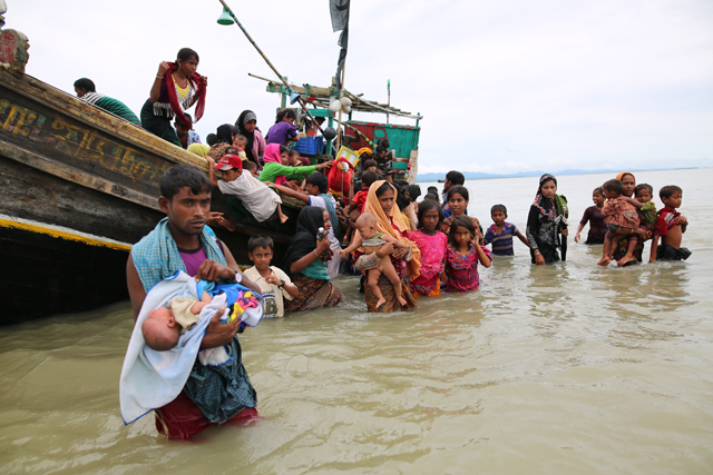 Rohingya Muslims, fled from ongoing military operations in Myanmar’s Rakhine state, fled Bangladesh by boat over sea in Shah pori island, Teknaff, Bangladesh, on Sunday (Anadolu Agency photo)