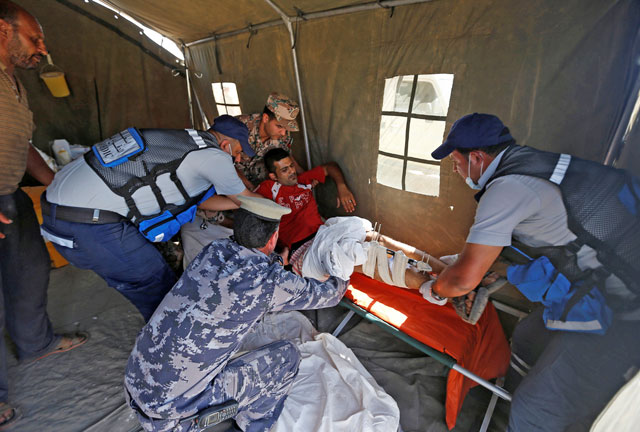 A displaced Syrian arrives to receive treatment at a Jordanian military medical outpost near the Jordanian-Syrian joint border, near Jaber crossing, in the city of Mafraq, Jordan, on Wednesday (Reuters photo)