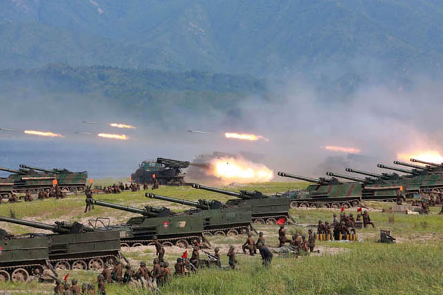 This undated photo released by North Korea's official Korean Central News Agency on Saturday shows rockets being launched by Korean People's Army personnel during a target strike exercise at an undisclosed location in North Korea (AFP photo) 
