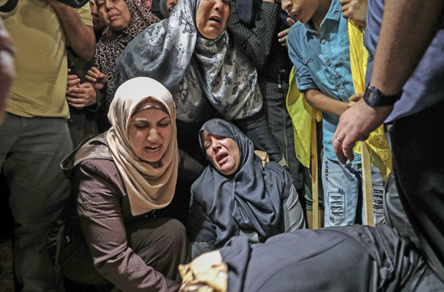 Relatives of Moein Abdel Hamid Al Saai, 58, who lost his life after Israeli occupation forces opened fire on a protest held to mark the 70th anniversary of the Nakba, mourn during a funeral ceremony at the Al Shati Refugee Camp in Gaza, Gaza City, on Saturday (Anadolu Agency photo)