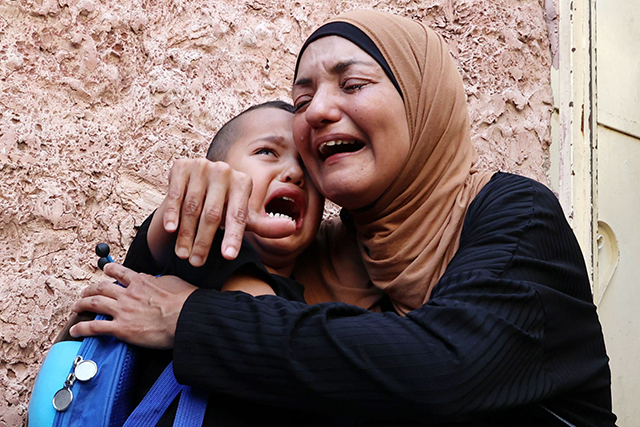 Relatives of Palestinian fighter Mustafa Al Kastouni, 32, killed in an Israeli military raid in the morning, weep during his funeral in Jenin in the occupied West Bank on Thursday (AFP photo)