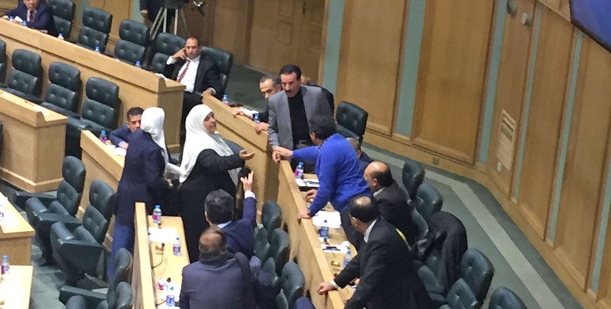 Lawmakers are seen involved in a heated argument, which broke out following ‘provocative’ remarks by MP Tarek Khoury during the House’s Tuesday meeting (Photo by Jassar Tahat)