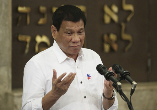 Philippine President Rodrigo Duterte gestures during his speech at the Beit Yaacov Synagogue, The Jewish Association of the Philippines in Makati, south of Manila, Philippines, on Tuesday (AP photo)