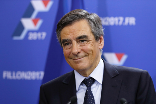 Candidate for the right-wing Les Republicains Party primaries ahead of the 2017 presidential election and former French prime minister, Francois Fillon reacts at his campaign headquarters after finishing first of the first round of the rightwing presidential primary, on Sunday, in Paris (AFP photo)