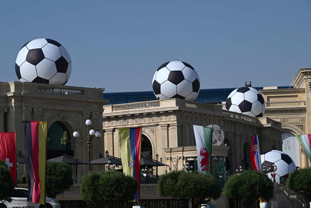 Giant replicas of the football are installed on a hotel in Doha on Saturday, ahead of the Qatar 2022 World Cup football tournament (AFP photo)