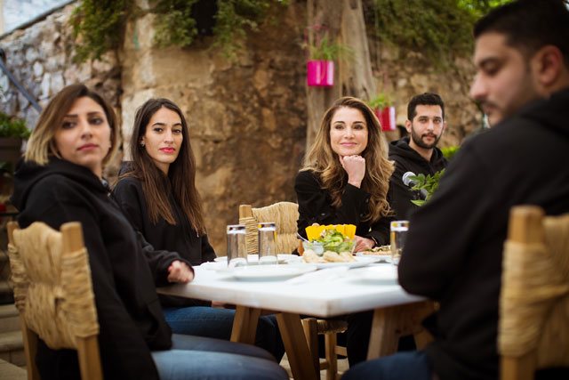 Her Majesty Queen Rania meets with members of the Nashmi Centre for Youth Empowerment in Jabal Amman on Monday  (Photo courtesy of Royal Court)