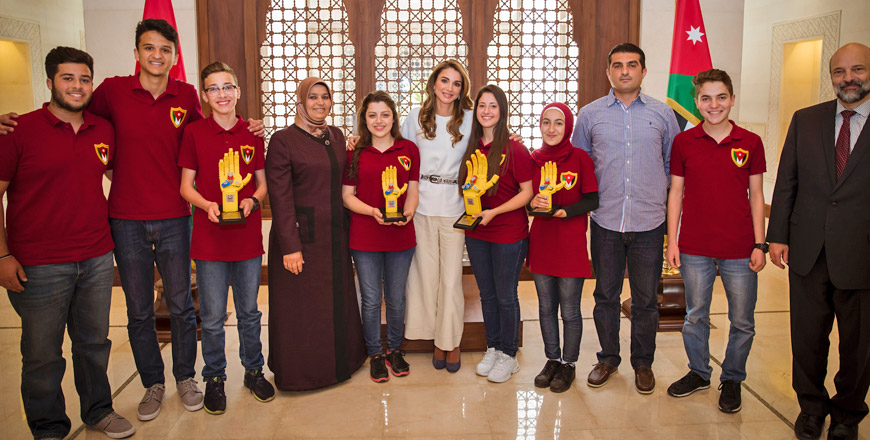 Her Majesty Queen Rania poses for a group photo with the winning Robo Stars team in Amman on Tuesday (Photo courtesy of the Royal Court)