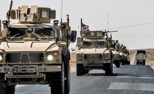 A US military convoy drives on a highway from Kobani to Ain Issa on Friday (AFP photo)