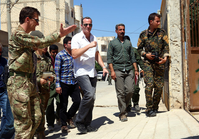 Brett McGurk (centre), US special presidential envoy for the Global Coalition to Counter Daesh, and Rupert Jones (left), deputy commander of Combined Joint Task Force – Operation Inherent Resolve, arrive for a meeting with the Tabaqa Civil Council in the town of Tabaqa, about 55 kilometres west of Raqqa city, on Thursday (AFP photo)