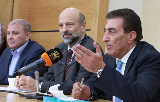 Prime Minister-designate Omar Razzaz (centre) and House leaders speak to reporters after a meeting they held at the Parliament on Monday (Photo by Hassan Tamimi)