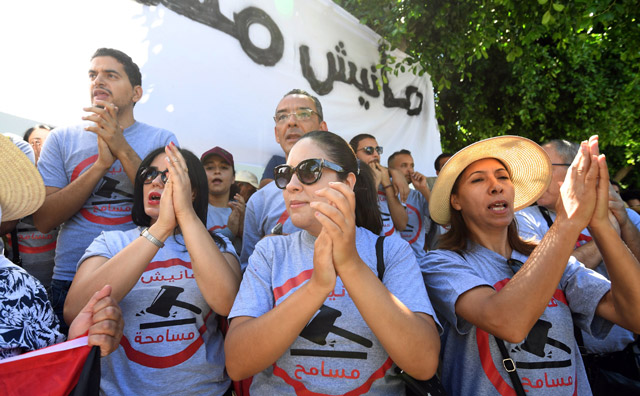 Tunisians chant slogans and wear t-shirts reading in the local Arabic dialect ‘I am not forgiving’, at a demonstration before parliament in the capital Tunis, on Friday (AFP photo)