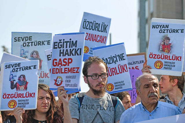 People demonstrate outside the Caglayan courthouse on Wednesday in Istanbul with banners reading ‘Freedom for Bogazici’ as a trial opened today of 21 students from Bogazici University described by Turkey's president as ‘terrorists’ after they opposed the Turkish military operation in Syria launched in January 2018 (AFP photo)