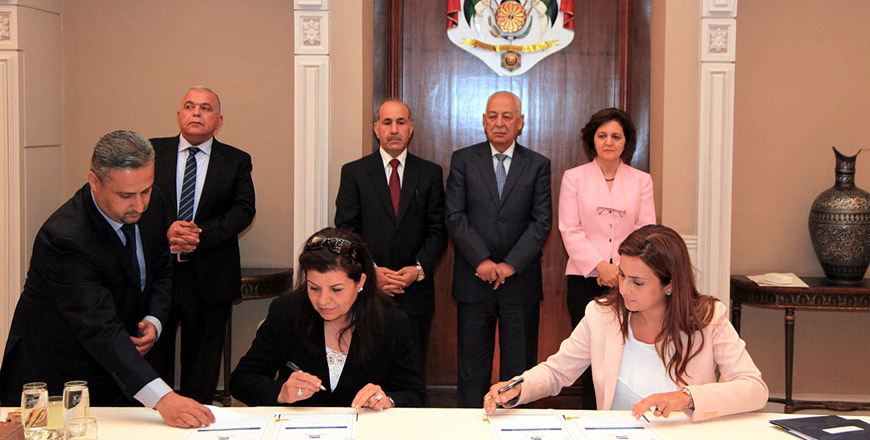 Officials sign agreements during the launch ceremony of a Royal initiative for community empowerment in Ajloun Governorate on Saturday (Petra photo)
