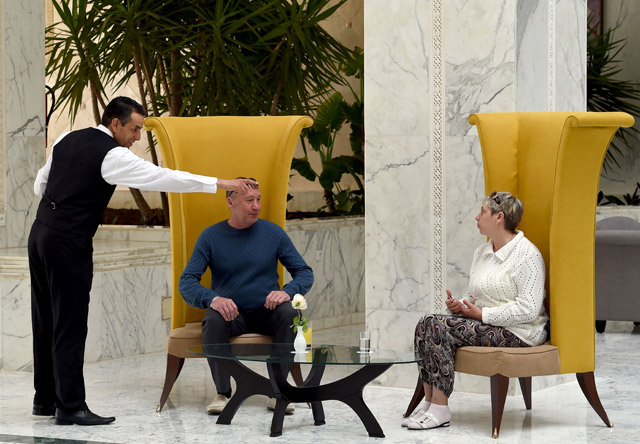 Tourists sit in a hall at the Imperial Marhaba Hotel in Port El Kantaoui, on the outskirts of Sousse south of the capital Tunis, on Friday (AFP photo)